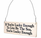 If You're Lucky Enough to Live By the Sea, You're Lucky Enough wood sign with saying