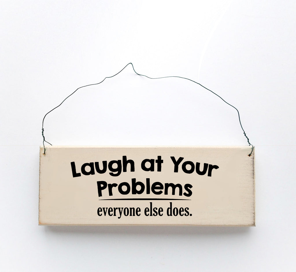 Wood sign saying: Laugh at Your Problems, Everyone Else Does. Handmade from natural, ethically sourced wood in Pembroke, MA.